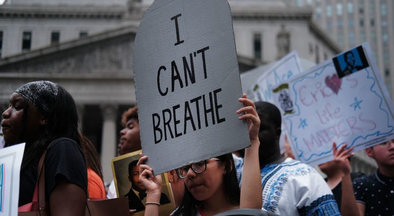 People participate in a protest to mark the five year anniversary of the death of Eric Garner during a confrontation with a police officer in the borough of Staten Island on July 17, 2019 in New York City. Eric Garner Protest