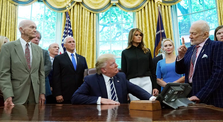 Apollo 11 astronauts Buzz Aldrin (R) and Michael Collins (L) and Neil Armstrong's son Rick Armstrong (2nd L) join U.S. President Donald Trump, first lady Melania Trump and Vice President Mike Pence as they commemorate the 50th anniversary of the moon land President Trump, Michael Collins, Buzz Aldrin