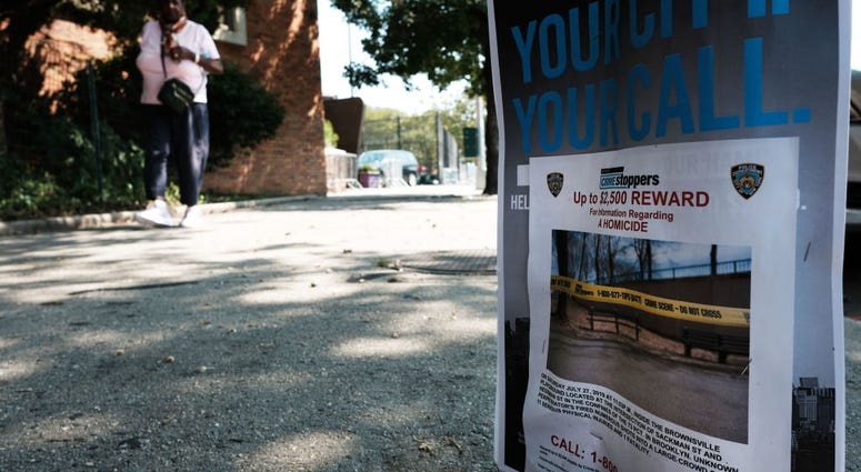 A flyer offers a reward for information on a shooting in the Brownsville neighborhood in Brooklyn where one person was shot and killed and 11 others were injured after two or more shooters opened fire during a massive block party on July 29, 2019. Brownsville Shooting