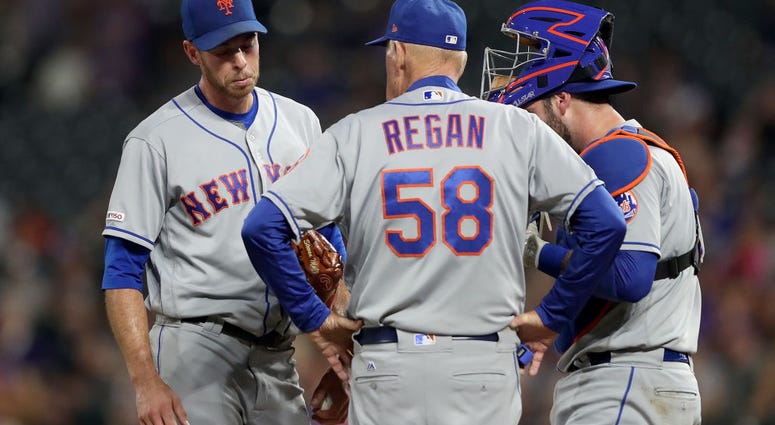Starting pitcher Steven Matz #32 , pitching coach Phil Regan #58 and catcher Tomas Nido #3 of the New York Mets confer in the fourth inning against the Colorado Rockies at Coors Field on September 16, 2019 Starting pitcher Steven Matz #32 , pitching coach Phil Regan #58 and catcher Tomas Nido #3 of the New York Mets confer in the fourth inning against the Colorado Rockies at Coors Field on September 16, 2019