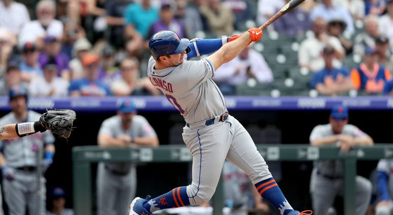 Pete Alonso #20 of the New York Mets hits a solo home run in the sixth inning against the Colorado Rockies at Coors Field on September 18, 2019 in Denver, Colorado. Pete Alonso