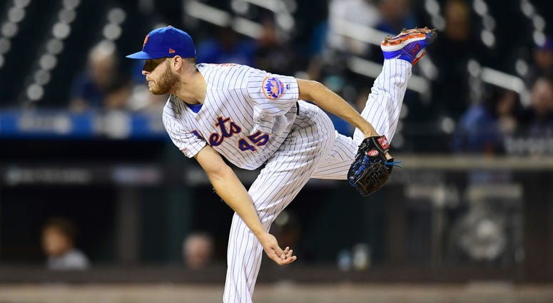 Zack Wheeler #45 of the New York Mets follows through with a pitch in the first inning of their game against the Miami Marlins at Citi Field on September 26, 2019 in the Flushing neighborhood of the Queens borough in New York City. Zack Wheeler #45 of the New York Mets follows through with a pitch in the first inning of their game against the Miami Marlins at Citi Field on September 26, 2019 in the Flushing neighborhood of the Queens borough in New York City.