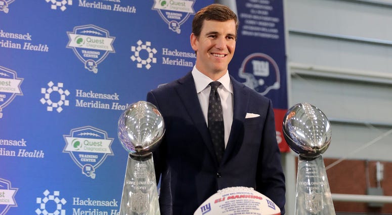 Eli Manning of the New York Giants poses with the Vince Lombardi Trophies after a press conference to announce his retirement on January 24, 2020 at Quest Diagnostic Training Center in East Rutherford, New Jersey. Eli Manning