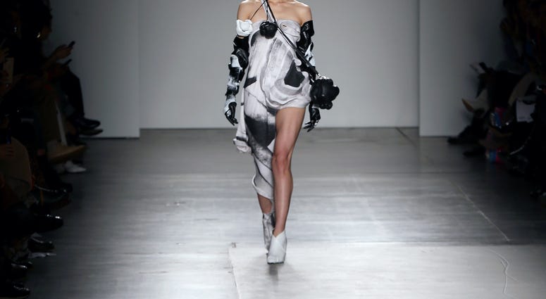 A model walks the runway wearing Junkai Huang during the Fashion Institute Of Technology's Fine Art Of Fashion And Technology Show at Pier 59 Studios on February 07, 2020 in New York, New York. FIT