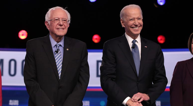 Democratic presidential candidates Sen. Bernie Sanders (I-VT) and former Vice President Joe Biden arrive on stage for the Democratic presidential primary debate at the Charleston Gaillard Center on February 25, 2020 in Charleston, South Carolina. Joe Biden Bernie Sanders