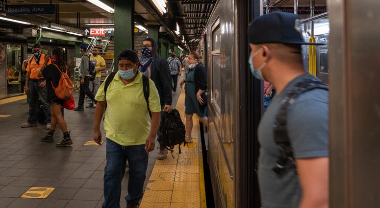 People ride the subway at Times Square during rush hour on the first day of phase one of the reopening after the coronavirus lockdown on June 8, 2020 in New York City. Coronavirus NYC