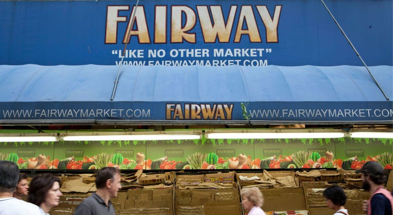 People walk past empty produce boxes on the sidewalk outside Fairway Market on Broadway on August 27, 2011 in New York City. Fairway Market