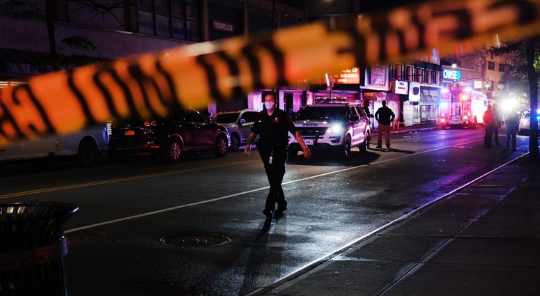 Police gather at the scene where two New York City police officers were shot in a confrontation late Wednesday evening in Brooklyn on June 03, 2020 in New York City. New York City Shooting