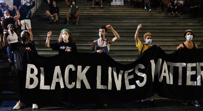 A group of protesters affiliated with Black Lives Matter (BLM) and other groups congregate in a park and adjoining street outside of City Hall in Lower Manhattan as they continue to demand that the New York City Police Department (NYPD) be defunded. Protest NYC
