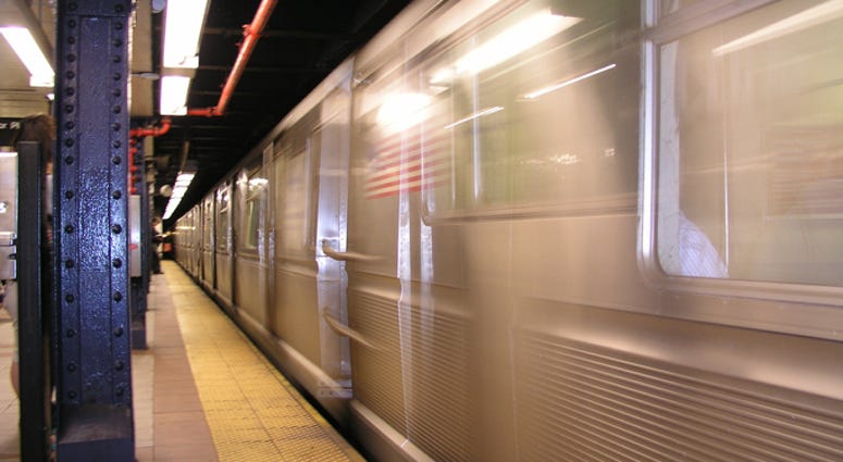 A subway train pulls out of a New York City subway Blurred subway train