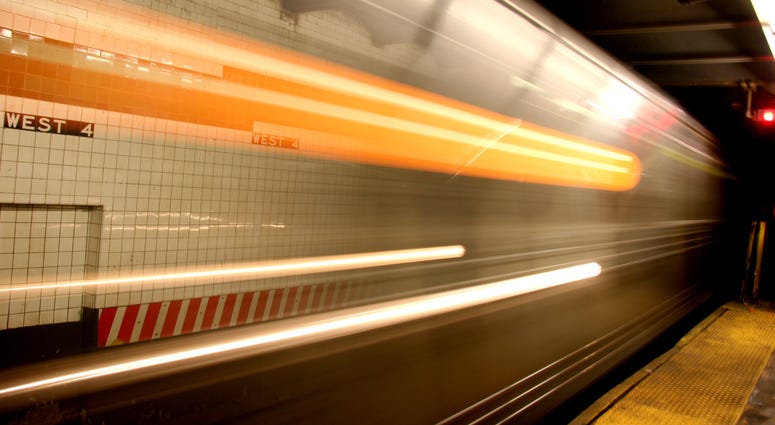 New York subway approaching a station with motion blur and moving lights. Blurred Subway Train