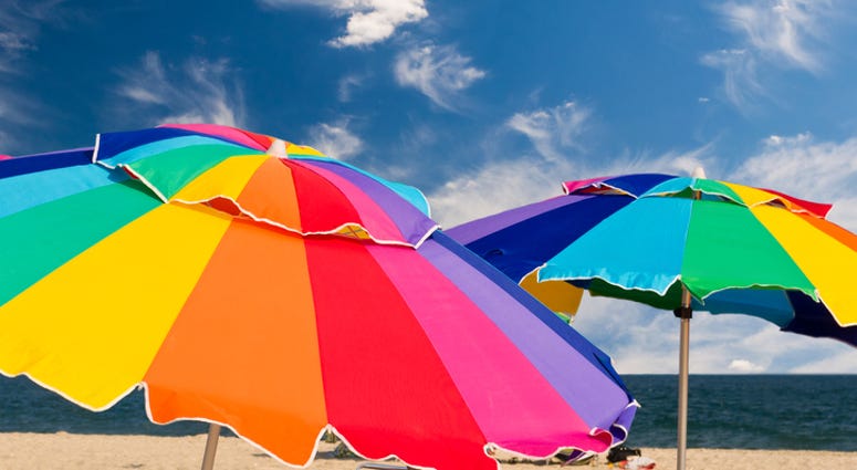 Close up of beach umbrellas with blue sky on background beach umbrellas