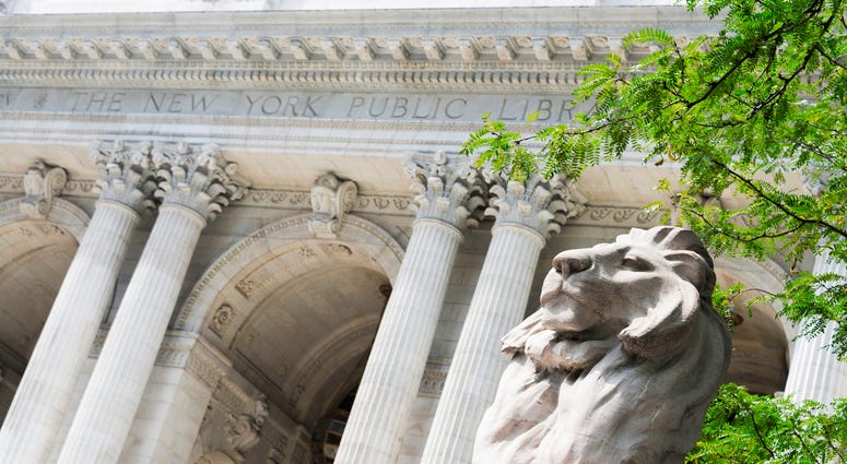 Angled view of the lion statue that flanks the front entrance to New York's Public Library. Public Library Lions