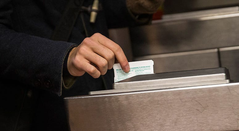 A man swipes his metro card at the entrance to the subway at Grand Central Terminal on March 23, 2015 in New York City. MTA MetroCard