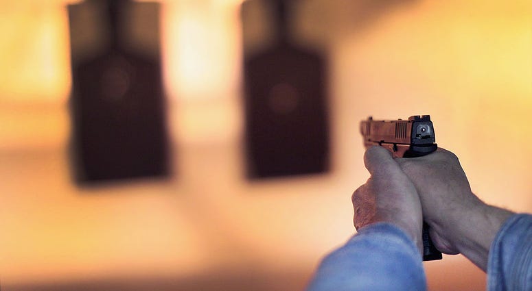 A marksman sights in on a target during a class he was taking to qualify for an Illinois concealed carry permit on February 14, 2014 in Posen, Illinois. Gun Range
