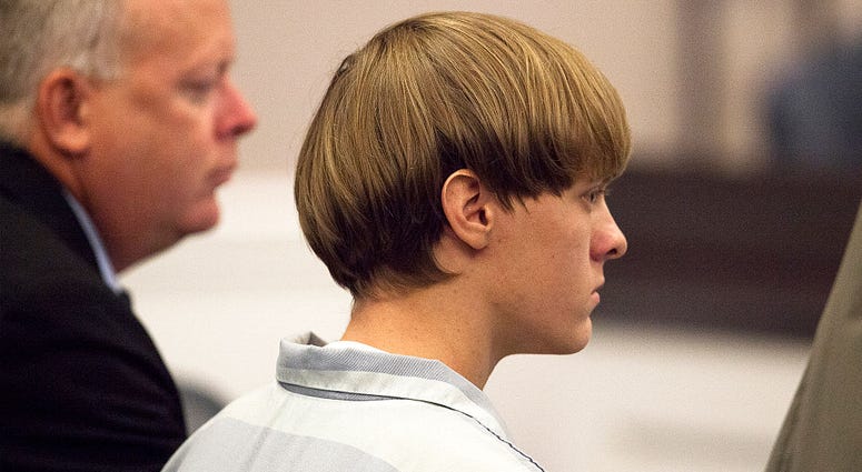 Dylann Roof (R), 21, listens to proceeding with assistant defense attorney William Maguire during a hearing at the Judicial Center July 16, 2015 in Charleston, South Carolina. Dylann Roof