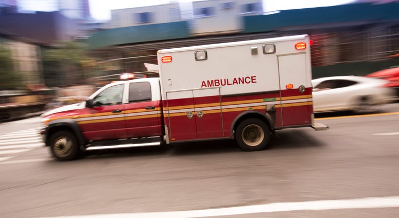 An ambulance makes its way through the busy streets of New York City. FDNY Ambulance (Getty)