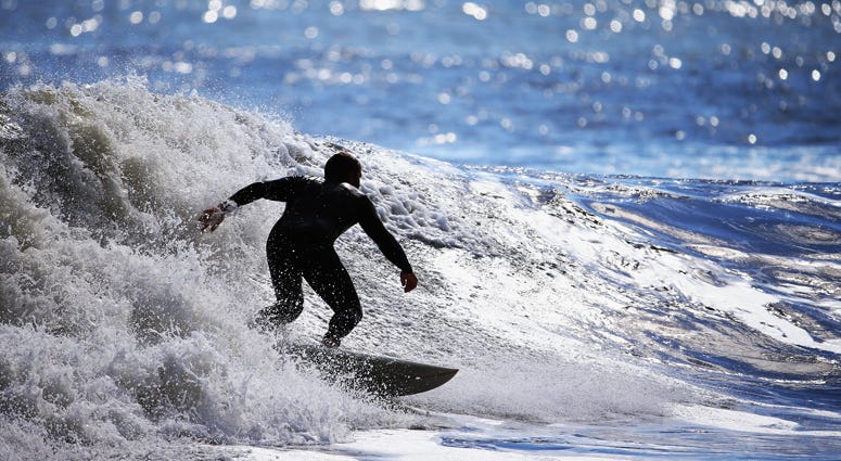 A surfer takes advantage of five to seven foot swells coming off the Atlantic Ocean on October 5, 2015 in Long Beach, New York. Surfing Off Log Island