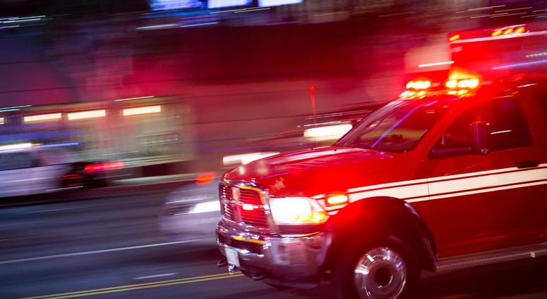 Emergency responders rush to the scene of an emergency. Ambulance