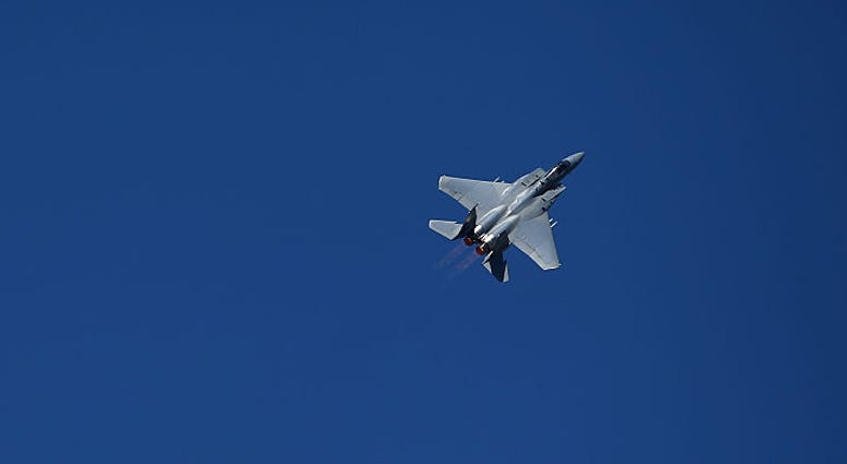 A F-15C Eagle performs during pre-race festivities prior to the NASCAR Sprint Cup Series Toyota/Save Mart 350 at Sonoma Raceway on June 26, 2016 in Sonoma, California. F-15C Eagle