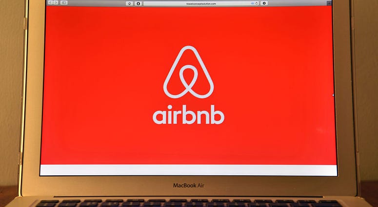 The Airbnb logo is displayed on a computer screen on August 3, 2016 in London, England. Airbnb logo