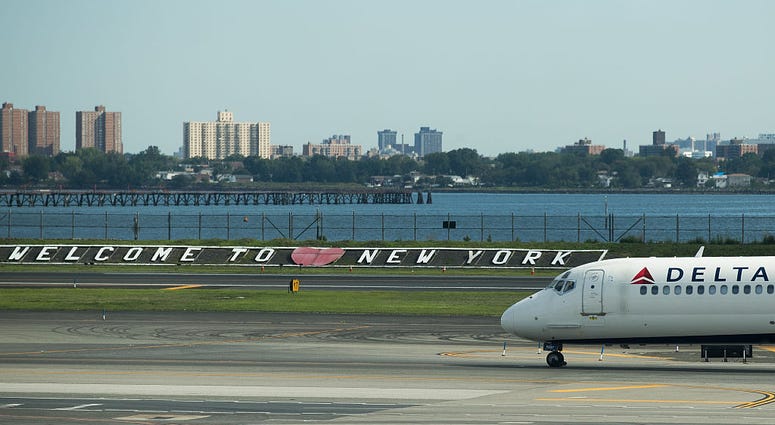 A Delta jet taxis on the tarmac at LaGuardia Airport , August 8, 2016 in the Queens borough of New York City. LaGuardia
