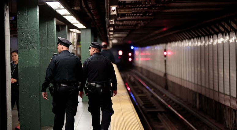 Members of the New York City Police patrol a subway station in Times Square, November 7, 2016 in New York City. MTA Police