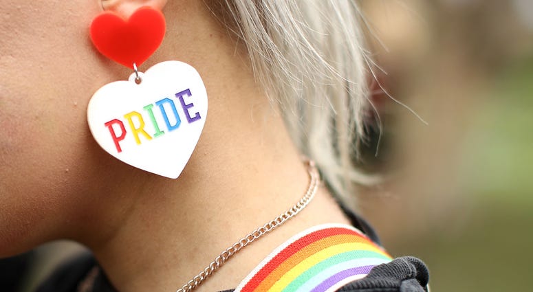 A detail view of a gay pride earring is seen as a runner prepares to take part in the annual Little Black Dress run at Centennial Park on February 26, 2017 in Sydney, Australia. Pride earring