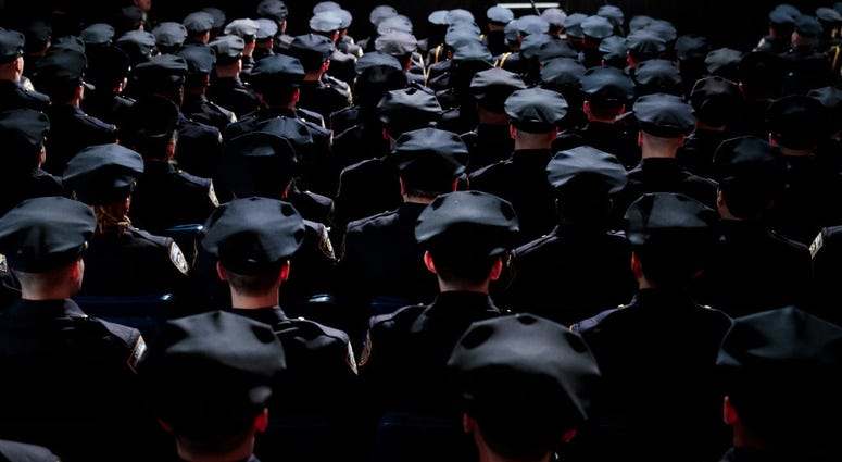The newest members of the New York City Police Department (NYPD) attend their police academy graduation ceremony at the Theater at Madison Square Garden, March 30, 2017 NYPD Officers