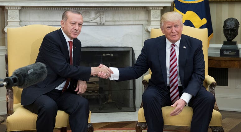 President Donald Trump, right, shakes hands with President of Turkey Recep Tayyip Erdogan in the Oval Office of the White House on May 16, 2017. Trump and Erdogan