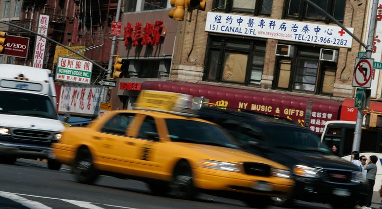 A cab driver in Chinatown. A cab driver in Chinatown