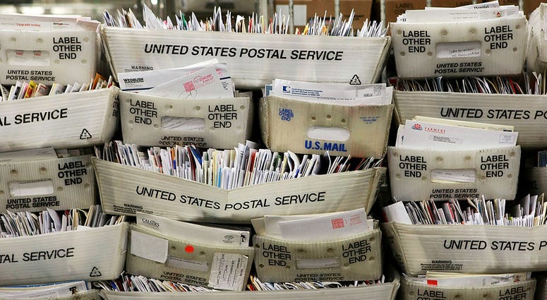 Stacks of boxes holding cards and letters are seen at the U.S. Post Office sort center December 15, 2008 in San Francisco, California. Post Office