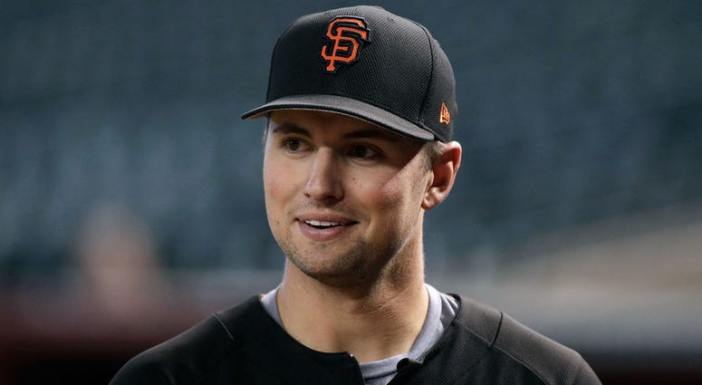 Joe Panik #12 of the San Francisco Giants looks on before the start of a MLB game against the Arizona Diamondbacks at Chase Field on September 25, 2017 in Phoenix, Arizona. Joe Panik