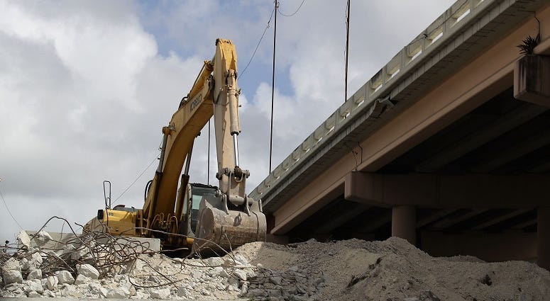 Heavy machinery is seen as construction workers build along State Road 836 on February 12, 2018 in Miami, Florida. Florida bridge construction