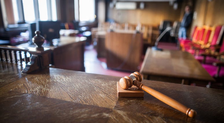 An image of a gavel in a court room. Courtroom