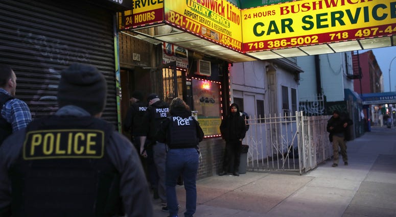 U.S. Immigration and Customs Enforcement (ICE), officers stage a raid to arrest an undocumented immigrant on April 11, 2018 in New York City. New ICE raid