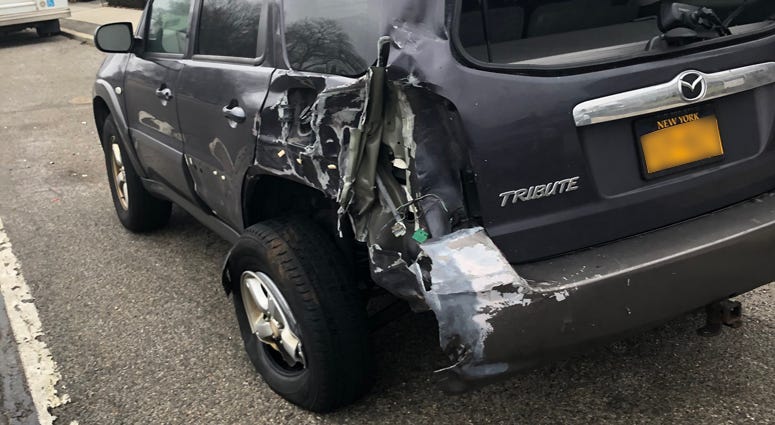 A damaged SUV that police say was struck by an officer who has been charged with DWI Nassau County officer charged with DWI