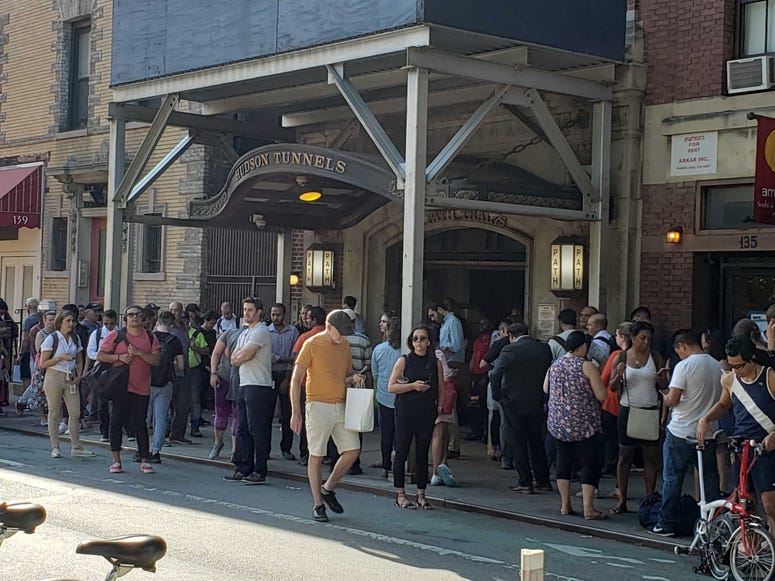 Commuters wait for updates on PATH service at Christopher Street on June 27, 2019. PATH Crowd