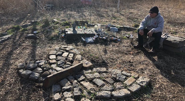 Philip Vetrano sits at a memorial for his daughter Philip Vetrano