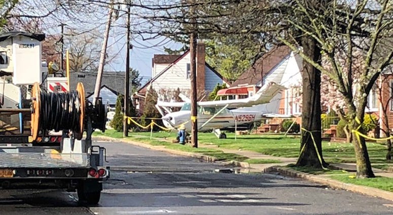 Small plane after going down on the front lawn of a Valley Stream home. Valley Stream plane crash
