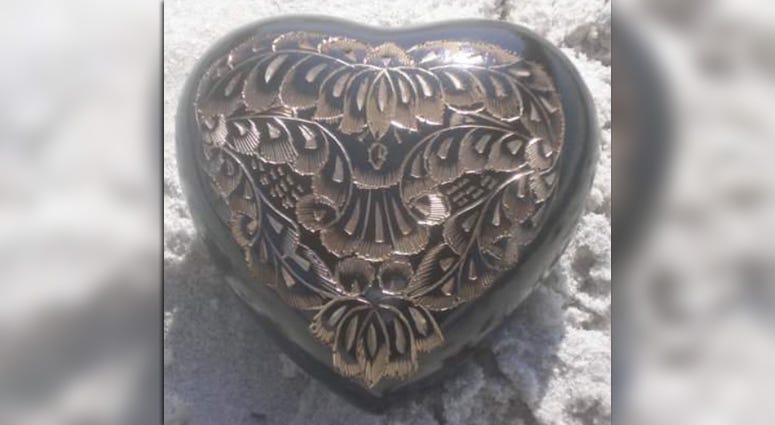Monique Hartley-Brown says this urn containing her son's ashes was stolen from her Garden City home Stolen urn