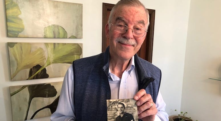 Bob Abate holds a photo of one of his interview subjects in his home on Nov. 8, 2019. Bob Abate