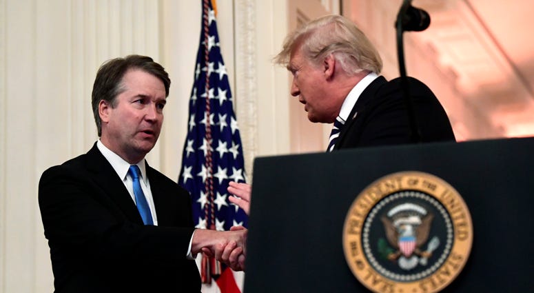 President Donald Trump shakes hands with Supreme Court Justice Brett Kavanaugh, before a ceremonial swearing-in in the East Room of the White House in Washington, Monday, Oct. 8, 2018. Justice Brett Kavanaugh, President Donald Trump