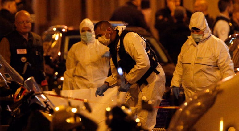 Scientific police officers investigate after a knife attack in central Paris, Saturday May 12, 2018 Paris Knife Attacks