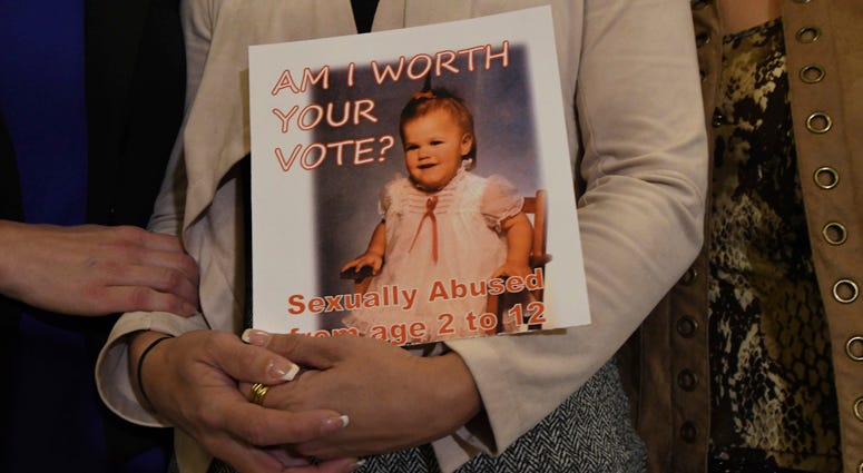 Carolyn Fortney, a survivor of sexual abuse at the hands of her family's Roman Catholic parish priest as a child, awaits legislation in the Pennsylvania Capitol to respond to a landmark state grand jury report on child sexual abuse in the Catholic Church.