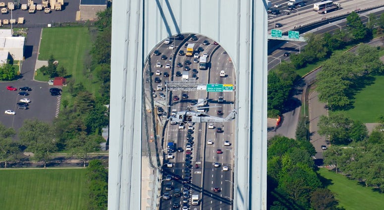 A U.S. Navy Blackhawk helicopter passes in front of the Verrazano-Narrows Bridge. Fleet Week 2018