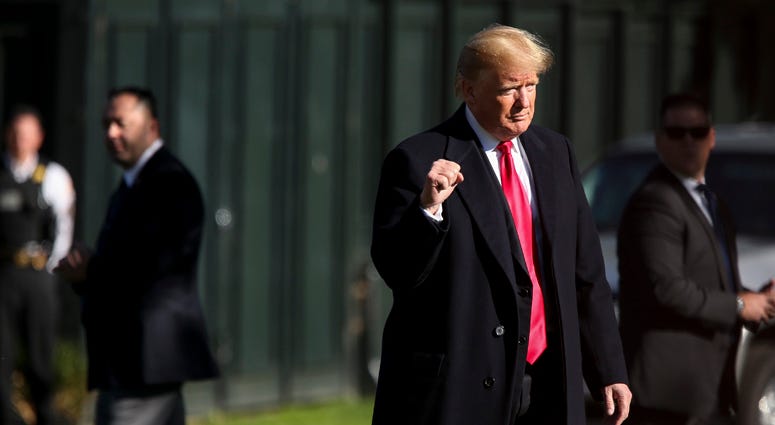 President Donald Trump reacts as he walks on the South Lawn before boarding Marine One on the White House, on October 18, 2018 in Washington, DC. President Donald Trump