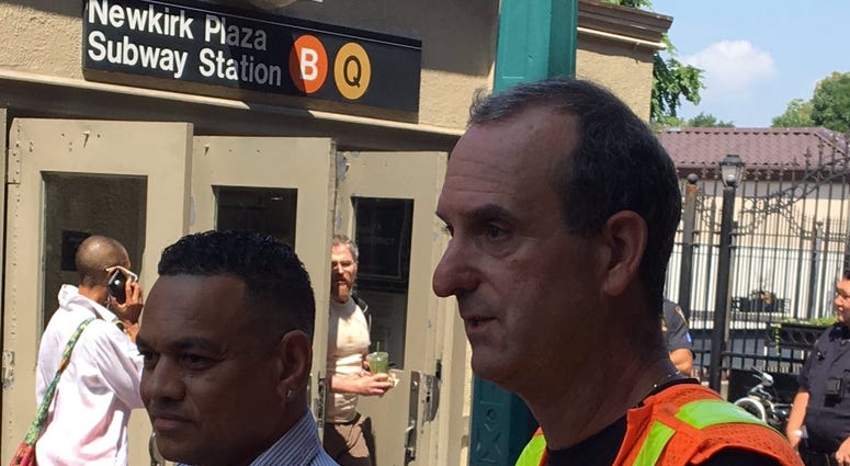 Two MTA employees save a woman Two MTA employees save a woman