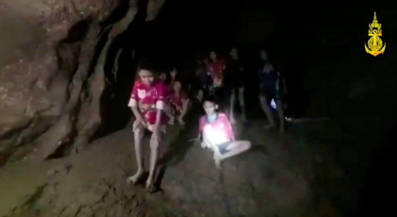 This Monday, July 2, 2018, photo released by Tham Luang Rescue Operation Center, shows the boys and their soccer coach as they were found in a partially flooded cave, in Mae Sai, Chiang Rai, Thailand. Thai Soccer Team In Cave Thai Soccer Team In Cave
