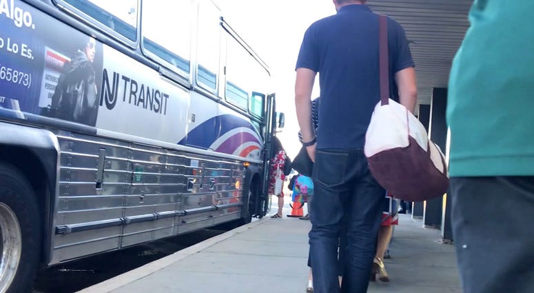 Commuters load onto a NJ Transit Bus at the Vince Lombardi Park and Ride in Ridgefield on Tuesday September 4, 2018. NJ Transit Bus